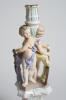 Cricket themed candlestick. Large ceramic candlestick the centre features two winged cherubs holding cricket bats on plinth, the base with four feet. A very colourful design in pastel coloured glaze in pink, light blue, mauve and yellow with gilt lustre. - 4