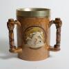 Doulton Lambeth stoneware tyg. Large and impressive three handled tyg with three moulded relief vignettes of cricketers, a batsman, a fielder and wicket keeper in white on a green cameo background, the sides highly decorated in a small floral pattern in b - 2
