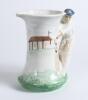 Burleigh Ware &lsquo;style&rsquo; art deco ceramic cricket jug. The jug based on the 1930&rsquo;s original with cricket field and pavilion design to body with &lsquo;batsman&rsquo; handle in white and green was produced in 2000 by Burgess, Dorling and Leigh, Burslem, near Stoke on Tre