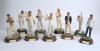 England. Nine Endurance Ltd or similar cold-cast porcelain cricketing figures of Len Hutton, Tom Graveney, Colin Cowdrey, Godfrey Evans, Geoff Boycott, Dickie Bird, David Gower, Ian Botham and Michael Vaughan. Complete with plinths and bats where necessar