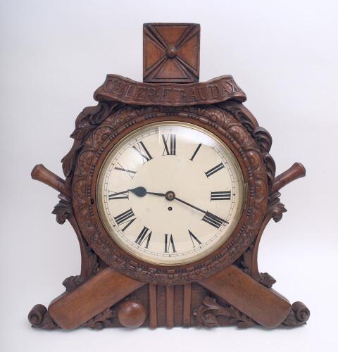 Cricket clock circa late 19th early 20th Century. Very large and impressive Victorian/ Edwardian clock with plain circular face set in an ornate heavy oak wooden frame consisting of carved floral border set on a background of crossed cricket bats, stumps 