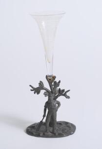 W.G. Grace c1896. Electroplated tulip vase cast with a figure of Grace standing with bat in front of a filigree tree in Art Nouveau style. Stamped &lsquo;W.W.H. & Co&rsquo; (W.W. Harrison & Co, Sheffield) to base. 5.5&rdquo; tall. With glass flute, which appears to be orig