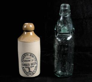 Cricket bottle. Attractive glazed ceramic earthernware cricket ginger beer bottle, c1900, with &lsquo;Joseph Smith of Accrington&rsquo; with cricket stumps and bails printed to side. Approx 7&rdquo; tall. Chip to lip of bottle, odd faults otherwise in good condition. Sold 