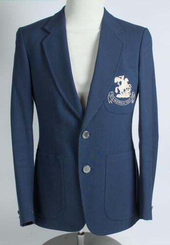 Robert William &lsquo;Bob&rsquo; Taylor. Derbyshire & England 1961-1988. M.C.C. mid blue touring blazer, by Burton, worn by Taylor on the M.C.C. tour of Australia and India in 1979/80. The blazer with embroidered M.C.C. emblem in white of St George & Dragon of Englan