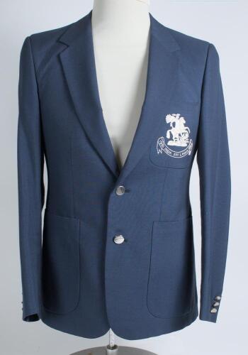 Robert William &lsquo;Bob&rsquo; Taylor. Derbyshire & England 1961-1988. M.C.C. mid blue touring blazer, by Burton, worn by Taylor on the M.C.C. tour of India and Sri Lanka in 1981/82. The blazer with embroidered M.C.C. emblem in white of St George & Dragon of Englan