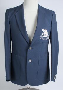 Robert William &lsquo;Bob&rsquo; Taylor. Derbyshire & England 1961-1988. M.C.C. mid blue touring blazer, by Burton, worn by Taylor on the M.C.C. tour of India and Sri Lanka in 1981/82. The blazer with embroidered M.C.C. emblem in white of St George & Dragon of Englan