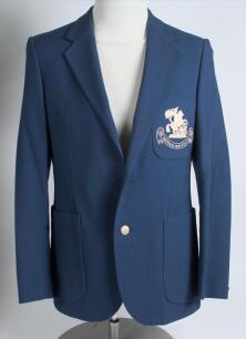 Robert William &lsquo;Bob&rsquo; Taylor. Derbyshire & England 1961-1988. M.C.C. mid blue touring blazer, by Burton, worn by Taylor on the M.C.C. tour of Australia and New Zealand in 1982/83. The blazer with embroidered M.C.C. emblem in white of St George & Dragon of 