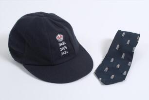 Robert William &lsquo;Bob&rsquo; Taylor. Derbyshire & England 1961-1988. England &lsquo;home&rsquo; Test cap and tie issued to Taylor during his playing career. The navy blue cap, by C&D of Australia, with central emblem of the three lions and crown to front. &lsquo;Bob Taylor&rsquo; handwr