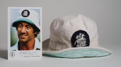 Robert William &lsquo;Bob&rsquo; Taylor. Derbyshire & England 1961-1988. Iconic white England sunhat worn by Taylor during his career. The white sunhat, blue lining, with attached England emblem of St. George and the dragon was regularly worn by Taylor whilst wicket 