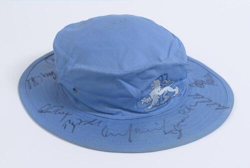 Alec Stewart. England blue sunhat with England emblem to front signed to rim by fourteen members of an England team from the 1990&rsquo;s. Signatures include Stewart, Atherton, Thorpe, Ramprakash, Gough, White, Fairbrother, Cork, Russell etc. &lsquo;Alec&rsquo; handwritten