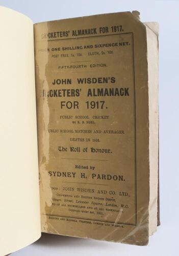 Wisden Cricketers&rsquo; Almanack 1917. 54th edition. Bound in dark brown boards, with original paper wrappers, title and date in gilt to spine. Wear with some loss of printed surface and text to both front and rear wrappers, corner wear, damage and loss, corne