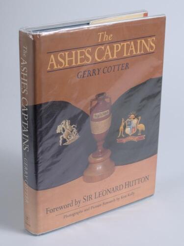 &lsquo;The Ashes Captains&rsquo;. Gerry Cotter. Marlborough 1989. Hardback with good dustwrapper. Signed to the inside front cover and endpapers by twenty two England captains, Dexter, Smith, Graveney, Illingworth, Denness, Edrich, Greig, Brearley, Botham, Willis, Go