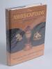 &lsquo;The Ashes Captains&rsquo;. Gerry Cotter. Marlborough 1989. Hardback with good dustwrapper. Signed to the inside front cover and endpapers by twenty two England captains, Dexter, Smith, Graveney, Illingworth, Denness, Edrich, Greig, Brearley, Botham, Willis, Go
