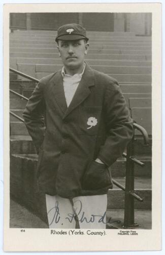 Wilfred Rhodes. Yorkshire & England 1898-1930. Excellent mono real photograph postcard of Rhodes, three quarter length, wearing Yorkshire blazer and cap and looking straight into the camera lens. Very nicely signed in ink to the photograph by Rhodes. Prin