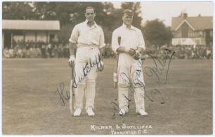 Yorkshire. Roy Kilner and Herbert Sutcliffe. Sepia real photograph postcard of Kilner and Sutcliffe standing full length on the outfield, both wearing batting attire. Early 1920s. Location and publisher unknown. Nicely signed in ink to the photograph by b