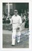 Thomas Frank Smailes. Yorkshire & England 1932-1948. Mono real photograph plain back postcard of Smailes, full length walking out to bat at Scarborough in 1936. Very nicely signed in blue ink with dedication by Smailes to the photograph. Official stamp to