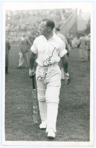 Paul Anthony Gibb. Yorkshire, Cambridge University, Essex & England 1935-1956. Mono real photograph plain back postcard of Gibb, full length wearing batting attire on the outfield at Scarborough in 1938. Very nicely signed in ink by Gibb to the photograph