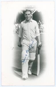 Douglas Ernest Vernon &lsquo;Doug&rsquo; Padgett. Yorkshire & England 1951-1971. Mono real photograph postcard of Padgett full length walking out to bat in cameo, c.1957. Nicely signed in blue ink to the photograph by Padgett. Walkers Studios, Scarborough. Postally u