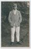 John Lindsay &lsquo;Jack&rsquo; Bryan. Kent & Cambridge University 1919-1932. Sepia real photograph postcard of Bryan standing full length, wearing striped blazer and Kent cap. Nicely signed in ink to the photograph by Bryan. Publisher unknown. Postally unused. An ex