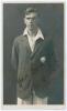 Alan Edward Watt. Kent 1929-1939. Sepia real photograph postcard of Watt standing three quarter length wearing cricket attire and Kent blazer. Signed in ink to the darker part of the photograph by Watt. B. & W. Fisk-Moore of Canterbury. Postally unused. S