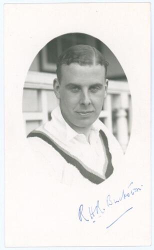 Robin Henry Rowland Buckston. Derbyshire 1928-1939. Mono real photograph postcard of Buckston in cameo, head and shoulders wearing cricket attire. Nicely signed in blue ink to lower border by Buckston. Official stamp to verso for A. Wilkes & Son, West Bro