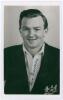 John Kenneth Richard &lsquo;Ken&rsquo; Graveney. Gloucestershire 1947- 1964. Mono real photograph plain back postcard of Graveney, head and shoulders wearing cricket attire and Gloucestershire blazer. Nicely signed in blue ink to the photograph by Graveney. Official 