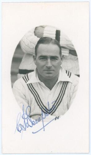 Charles Stewart &lsquo;Stewie&rsquo; Dempster. Wellington, Leicestershire, Warwickshire & New Zealand 1921-1948. Mono real photograph postcard of Dempster, head and shoulders in cameo wearing cricket attire. Nicely signed in ink to the photograph by Dempster. Officia