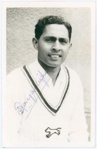 Stanley Jayasinghe. Leicestershire 1961-1965. Mono real photograph plain back postcard of Jayasinghe, head and shoulders wearing cricket attire. Nicely signed in blue ink to the photograph by Jayasinghe. Official stamp to verso for A. Wilkes & Son, West B
