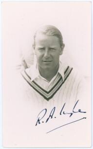 Reginald Addington &lsquo;Reggie&rsquo; Ingle. Somerset & Cambridge University 1923-1939. Mono real photograph postcard of Ingle in cameo, head and shoulders wearing cricket attire. Nicely signed in ink to the photograph by Ingle. Official stamp to verso for A. Wilke