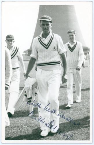 Keith Robert Dollery. Queensland, Auckland, Tasmania & Warwickshire 1947-1956. Mono real photograph plain back postcard of Dollery, full length walking off the field wearing cricket attire. Nicely signed in blue ink to the photograph by Dollery. Appears t