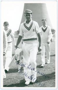 Keith Robert Dollery. Queensland, Auckland, Tasmania & Warwickshire 1947-1956. Mono real photograph plain back postcard of Dollery, full length walking off the field wearing cricket attire. Nicely signed in blue ink to the photograph by Dollery. Appears t