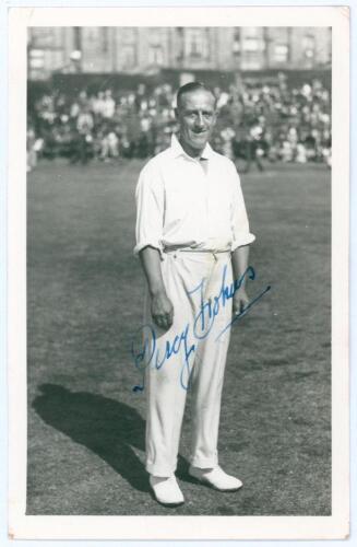 Percy Holmes. Yorkshire & England 1913-1933. Mono real photograph plain back postcard of Holmes standing full length on the outfield at Scarborough wearing cricket attire. Nicely signed in blue ink to the photograph by Holmes. Official stamp to verso for 
