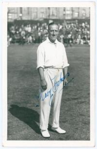 Percy Holmes. Yorkshire & England 1913-1933. Mono real photograph plain back postcard of Holmes standing full length on the outfield at Scarborough wearing cricket attire. Nicely signed in blue ink to the photograph by Holmes. Official stamp to verso for 