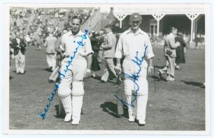 Yorkshire. Herbert Sutcliffe and Len Hutton. Mono real photograph plain back postcard of Sutcliffe and Hutton walking out to bat at Scarborough. Nicely signed in blue ink to the photograph by both Sutcliffe and Hutton. Date annotated to verso 1937. Appear