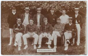 Gloucestershire 1904. Early sepia real photograph postcard of the Gloucestershire team for the match v Sussex at Hove, 23rd- 25th May 1904. Players depicted seated and standing in rows wearing blazers, caps, boaters, include Jessop (Captain), Thomas, Gods