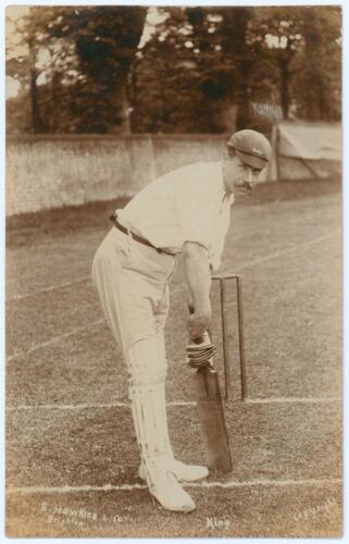 John Herbert King. Leicestershire & England 1895-1925. Early sepia real photograph postcard of King full length in batting pose at the wicket wearing Leicestershire cap. E. Hawkins & Co. of Brighton. Postally unused. Very good condition. An excellent imag