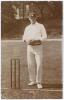Walter Scott Lees. Surrey & England 1896-1911. Early sepia real photograph postcard of Lees standing full length at the wicket wearing a Surrey cap and holding a ball. Foster of Brighton. Postally used, date unknown. Minor wear to edges and corners, other
