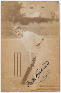 Frederick Charles Holland. Surrey 1894-1908. Early sepia real photograph postcard of Holland full length at the wicket in batting pose wearing a Surrey cap. Signed in black ink to the photograph by Holland, slight smudging to the signature. Foster of Brig