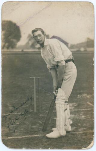 Percy Jeeves. Warwickshire 1912-1914. Early sepia real photograph postcard of Jeeves standing full length at the crease in batting pose. Nicely signed in black ink to the photograph by Jeeves. Publisher unknown. Postally unused. Rounding to corners and cr