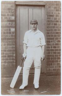 Thomas James Denton Birtles. Yorkshire 1913-1924. Early sepia real photograph postcard of Birtles standing full length in front of a door leaning on his bat wearing a Yorkshire cap. E. Hawkins & Co., Brighton. Postally unused. Minor wear to corners, other