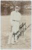 William Herbert Wilkinson. Yorkshire 1903-1910. Early sepia real photograph postcard of Wilkinson standing full length at the wicket leaning on his bat wearing a Yorkshire cap. E. Hawkins & Co., Brighton. Boldly signed to the photograph in black ink by Wi