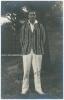 Kumar Shri Duleepsinhji. Sussex, Cambridge University & England 1924-1932. Excellent original mono real photograph postcard of Duleep standing full length under a tree, wearing cricket attire and striped blazer. The postcard very nicely signed in black in