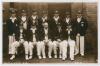 Nottinghamshire C.C.C. 1932. Sepia real photograph postcard of the Nottinghamshire team seated and standing in rows wearing county blazers and caps, with the captain, Arthur Carr to the centre, also Larwood, S.J. Staples, A. Staples, Lilley, Voce etc. Pho