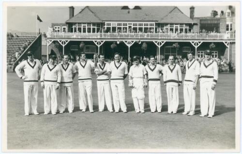 Australia tour to England 1956. Original mono real photograph postcard of the Australian team for the tour match v T.N. Pearce&rsquo;s XI at Scarborough 5th- 7th September 1956, the players standing in one row wearing cricket attire in front of the pavilion. Pl