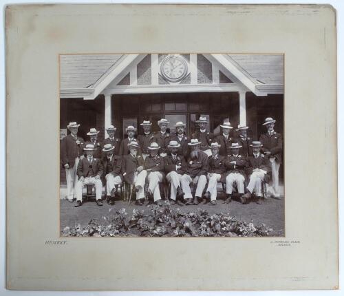 W.G. Grace. Early large original mono photograph of Grace with the England lawn bowling team seated and standing in rows all wearing matching jackets and straw hats in front of a pavilion on a visit to Belfast, Northern Ireland c.1910. Grace is seated fou