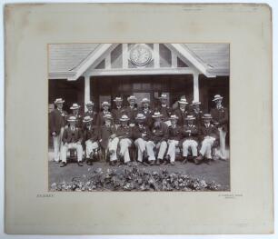 W.G. Grace. Early large original mono photograph of Grace with the England lawn bowling team seated and standing in rows all wearing matching jackets and straw hats in front of a pavilion on a visit to Belfast, Northern Ireland c.1910. Grace is seated fou