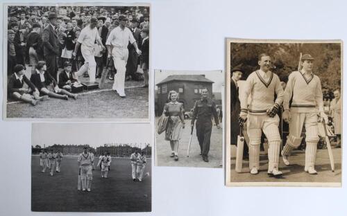 Len Hutton. Yorkshire & England 1934-1955. Four original press photographs featuring Hutton. Images depict Hutton walking out to bat through the crowds for Yorkshire v Lancashire 1939. A wartime photograph of Hutton wearing army uniform, walking bat in ha