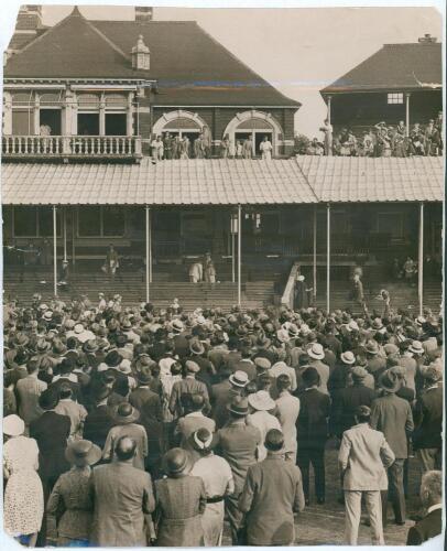England v South Africa 1935. Large original sepia press photograph of the South African players on the balcony at the Kennington Oval at the close of the 5th Test, 17th- 20th August 1935, celebrating their first Test series victory in England, with large 