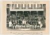 &lsquo;Mr. Jenneson Taylor&rsquo;s XI v. Mr. H.D.G. Leveson Gower&rsquo;s XI&rsquo; 1931. Original mono photograph of the teams seated and standing in rows wearing cricket attire and assorted blazers in front of the pavilion with spectators seated behind. The match was played 13