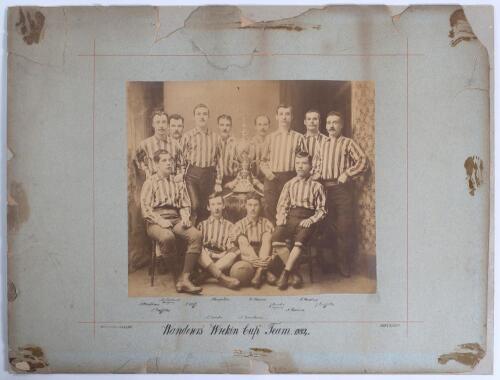Wolverhampton Wanderers 1884. Very early original sepia photograph of the &lsquo;Wanderers &ldquo;Wrekin Cup&rdquo; Team, 1884&rsquo;, the players seated and standing wearing football attire, surrounding the trophy to the centre. The photograph by William J. Sadler of Wolverhamp